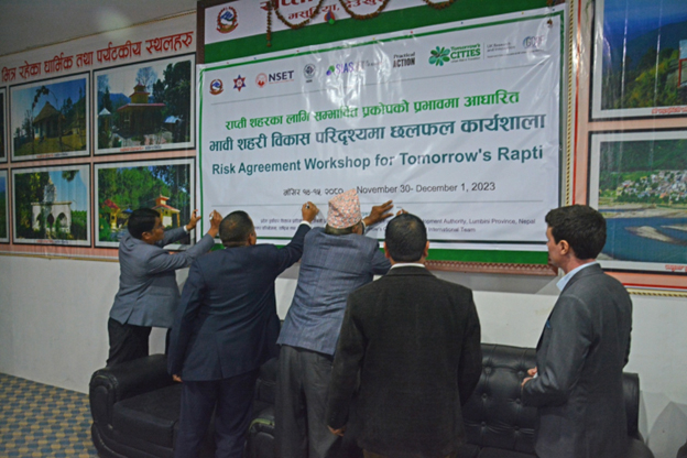 Guests signing on Event Banner to commence proceedings of Risk Agreement Workshop in Rapti, Photo: NSET